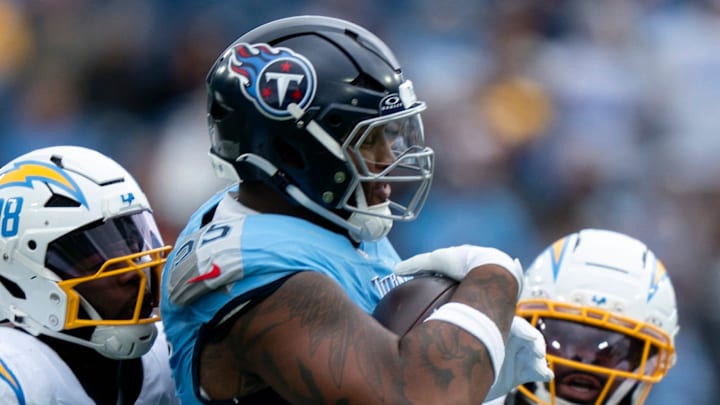Tennessee offensive tackle JC Latham (55) comes up with a fumble against the Los Angeles defense during their game at Nissan Stadium in Nashville, Tenn., Sunday, Nov. 2, 2025.