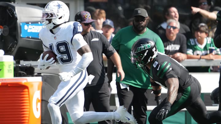 Dallas Cowboys wide receiver Ryan Flournoy (19) carries the ball as New York Jets safety Andre Cisco (8) defends during the first half at MetLife Stadium.