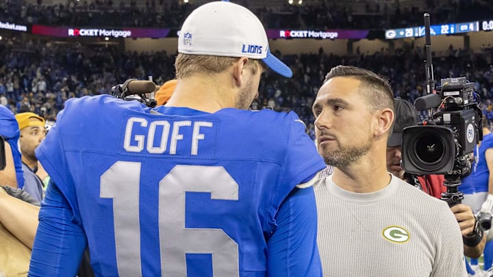 Green Bay Packers Head Coach Matt LaFleur talks to Detroit Lions quarterback Jared Goff.