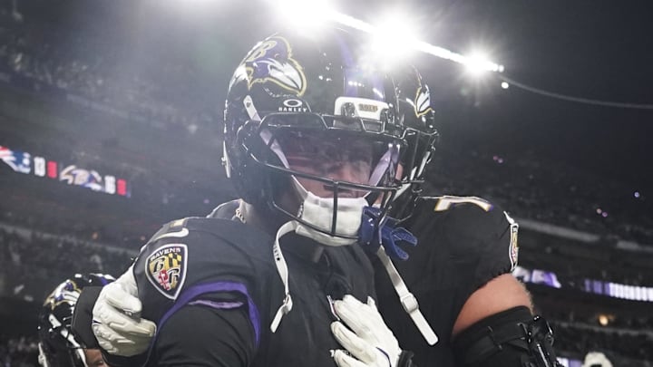 Dec 21, 2025; Baltimore, Maryland, USA;  Baltimore Ravens wide receiver Zay Flowers (4) celebrates his touchdown against the New England Patriots with teammates during the second half of the game at M&T Bank Stadium. Mandatory Credit: James Lang-Imagn Images