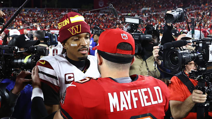 Washington Commanders quarterback Jayden Daniels greets Tampa Bay Buccaneers quarterback Baker Mayfield.
