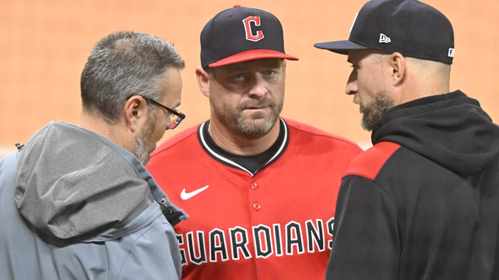 Apr 29, 2025; Cleveland, Ohio, USA; Curtis Danburg (left) of the Cleveland Guardians talks with managers Stephen Vogt (center) and Rocco Baldelli during a weather delay at Progressive Field. Mandatory Credit: David Richard-Imagn Images Apr 29, 2025; Cleveland, Ohio, USA; Curtis Danburg (left) of the Cleveland Guardians talks with managers Stephen Vogt (center) and Rocco Baldelli during a weather delay at Progressive Field. Mandatory Credit: David Richard-Imagn Images
