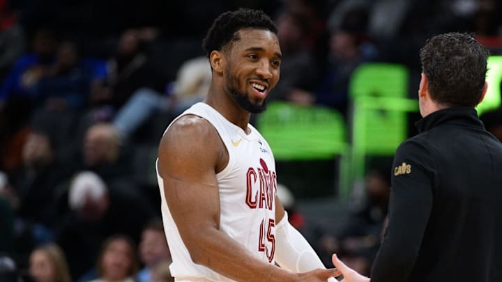 Feb 7, 2025; Washington, District of Columbia, USA; Cleveland Cavaliers guard Donovan Mitchell (45) reacts on the sideline with Cleveland Cavaliers head coach Kenny Atkinson during the second quarter against the Washington Wizards at Capital One Arena. Mandatory Credit: Reggie Hildred-Imagn Images