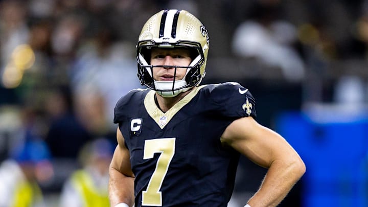 Sep 8, 2024; New Orleans, Louisiana, USA;  New Orleans Saints quarterback Taysom Hill (7) looks on against the Carolina Panthers during the pregame at Caesars Superdome. Mandatory Credit: Stephen Lew-Imagn Images