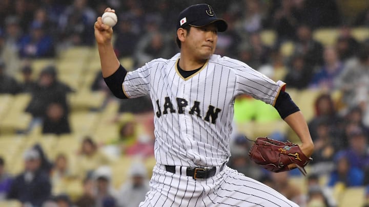Mar 21, 2017; Los Angeles, CA, USA; Japan pitcher Tomoyuki Sugano (11) throws a pitch during the first inning against United States during the 2017 World Baseball Classic at Dodger Stadium