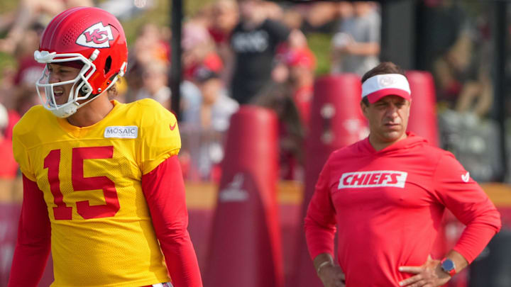 Jul 26, 2024; Kansas City, MO, USA; Kansas City Chiefs quarterback Patrick Mahomes (15) steps to the line as general manager Brett Veach watches in the background during training camp at Missouri Western State University. Mandatory Credit: Denny Medley-Imagn Images