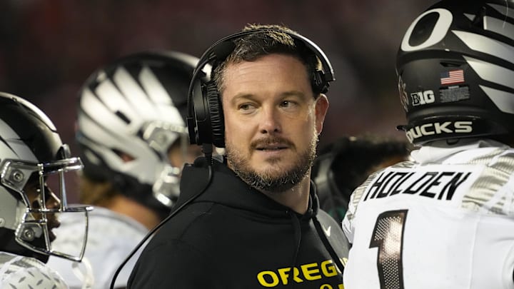 Nov 16, 2024; Madison, Wisconsin, USA;  Oregon Ducks head coach Dan Lanning looks on during the third quarter against the Wisconsin Badgers at Camp Randall Stadium. 