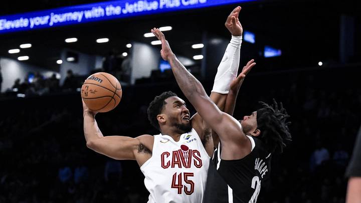 Feb 20, 2025; Brooklyn, New York, USA; Cleveland Cavaliers guard Donovan Mitchell (45) tries to dunk the ball as Brooklyn Nets center Day'Ron Sharpe (20) defends during the second half at Barclays Center. Mandatory Credit: John Jones-Imagn Images Feb 20, 2025; Brooklyn, New York, USA; Cleveland Cavaliers guard Donovan Mitchell (45) tries to dunk the ball as Brooklyn Nets center Day'Ron Sharpe (20) defends during the second half at Barclays Center. Mandatory Credit: John Jones-Imagn Images