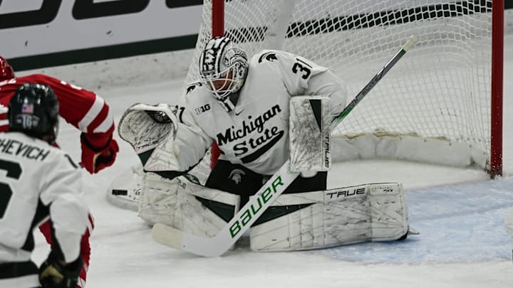 MSU goalie Luca Di Pasquo protects the net against Wisconsin, Thursday, Jan. 2, 2024, at Munn Ice Arena. MSU goalie Luca Di Pasquo protects the net against Wisconsin, Thursday, Jan. 2, 2024, at Munn Ice Arena.