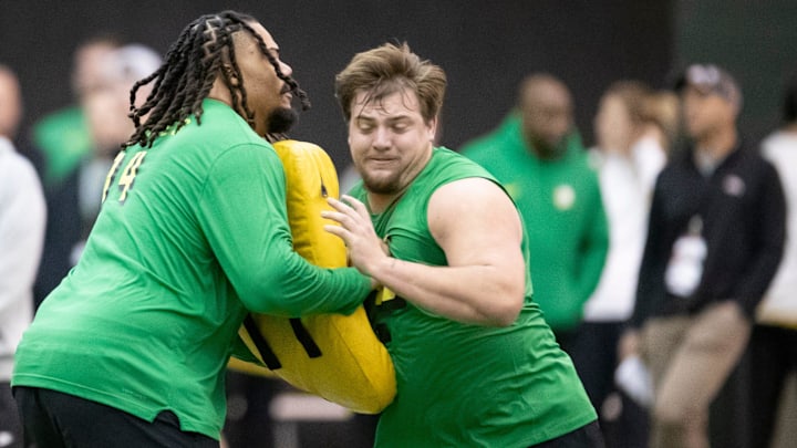 Oregon offensive linemen Steven Jones, left, and Jackson Powers-Johnson