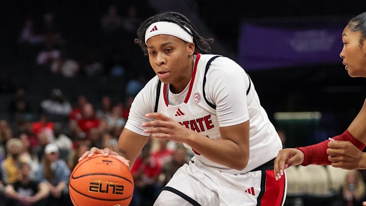 Nov 9, 2025; Charlotte, North Carolina, USA;  NC State Wolfpack guard Zoe Brooks (35) drives the ball against the Southern California Trojans during the second quarter of the Ally Tipoff game at Spectrum Center. Mandatory Credit: Cory Knowlton-Imagn Images