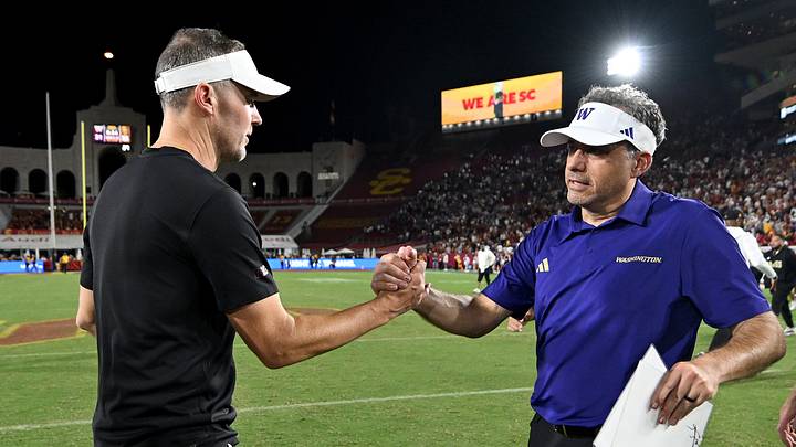 Oct 3, 2026; Los Angeles, California, USA; USC Trojans head coach Lincoln Riley and Washington Huskies head coach Jedd Fisch shake hands after the game at United Airlines Field at Los Angeles Memorial Coliseum. Mandatory Credit: Griffin Hooper-Imagn Images Oct 3, 2026; Los Angeles, California, USA; USC Trojans head coach Lincoln Riley and Washington Huskies head coach Jedd Fisch shake hands after the game at United Airlines Field at Los Angeles Memorial Coliseum. Mandatory Credit: Griffin Hooper-Imagn Images