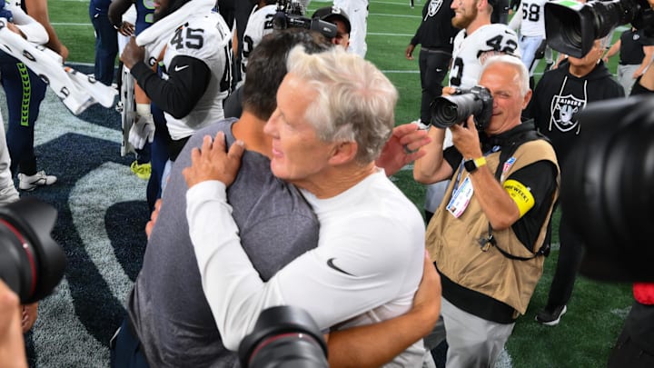 Aug 7, 2025; Seattle, Washington, USA; Las Vegas Raiders head coach Pete Carroll and Seattle Seahawks head coach Mike Macdonald hug after the game at Lumen Field. Mandatory Credit: Steven Bisig-Imagn Images