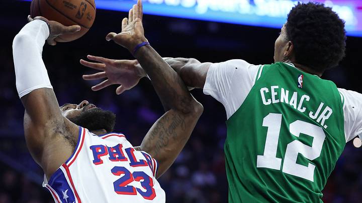 Oct 16, 2026; Philadelphia, Pennsylvania, USA; Philadelphia 76ers forward LeBron James (23) is fouled by Boston Celtics forward Chris Cenac Jr. (12) during the second quarter at Xfinity Mobile Arena. Mandatory Credit: Bill Streicher-Imagn Images