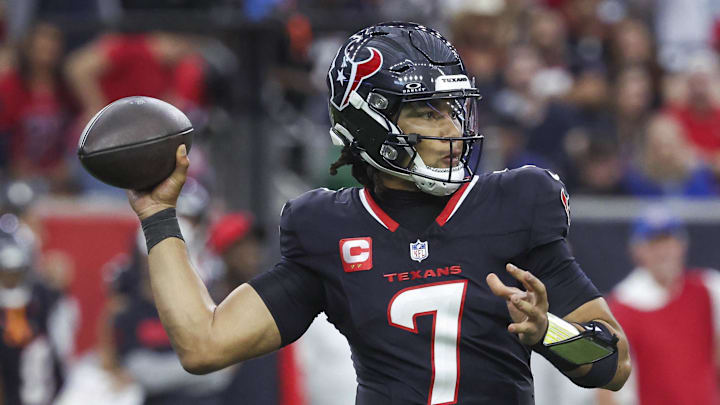 Dec 15, 2024; Houston, Texas, USA; Houston Texans quarterback C.J. Stroud (7) throws the ball during the game against the Miami Dolphins at NRG Stadium. Mandatory Credit: Troy Taormina-Imagn Images