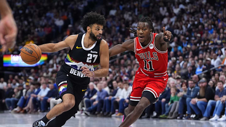 Nov 17, 2025; Denver, Colorado, USA; Denver Nuggets guard Jamal Murray (27) drives past Chicago Bulls guard Ayo Dosunmu (11) in the second half at Ball Arena. Mandatory Credit: Ron Chenoy-Imagn Images