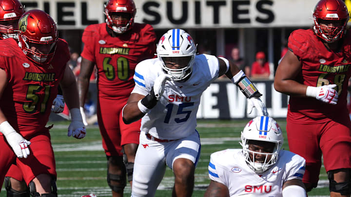 Louisville’sTyler Shough is sacked by SMU’s Jayden Milliner-Jones this Saturday.