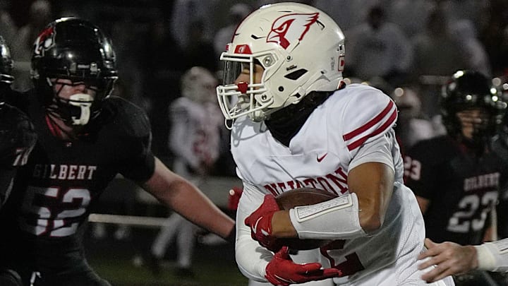 Newton Cardinals running backdefensive back Isaiah Hansen (2) runs for a touchdown against Gilbert during the second quarter in the high school football class 4A quarterfinal on Nov. 7, 2025, at Tigers Stadium, Gilbert, Iowa.