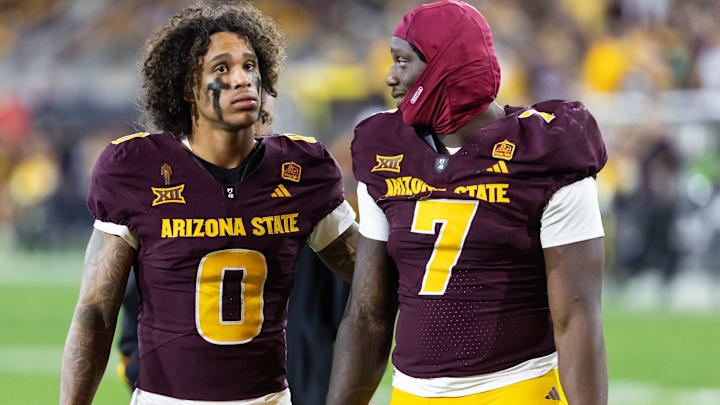 Nov 28, 2025; Tempe, Arizona, USA; Arizona State Sun Devils wide receiver Jordyn Tyson (0) with tight end Chamon Metayer (7) against the Arizona Wildcats during the 99th Territorial Cup at Mountain America Stadium. Mandatory Credit: Mark J. Rebilas-Imagn Images