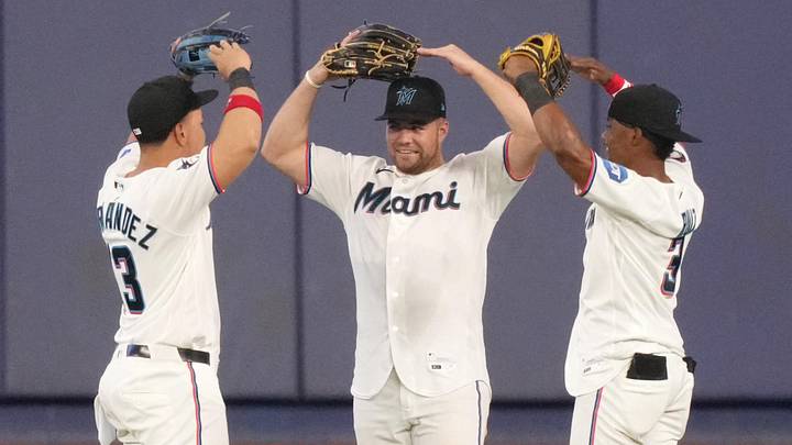Miami Marlins left fielder Heriberto Hernández, center fielder Jakob Marsee and right fielder Esteury Ruiz celebrate.
