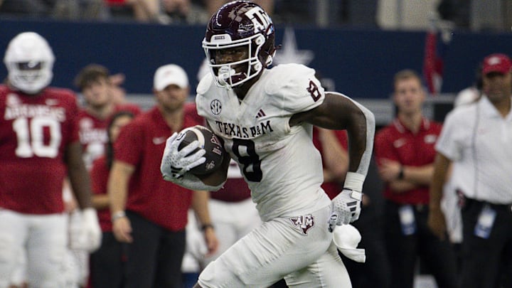 Texas A&M Aggies RB Le'Veon Moss runs for a first down against the Arkansas Razorbacks.