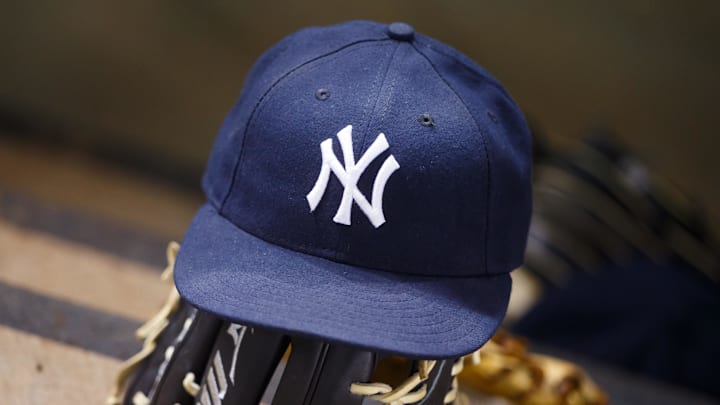 May 18, 2016; Phoenix, AZ, USA; Detailed view of a New York Yankees hat and baseball glove against the Arizona Diamondbacks at Chase Field. Mandatory Credit: Mark J. Rebilas-Imagn Images