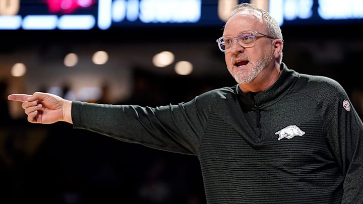 Arkansas head coach Mike Neighbors works with his team against Vanderbilt during the first quarter at Memorial Gym in Nashville, Tenn., Thursday, Jan. 23, 2025.
