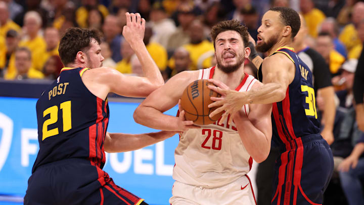 Apr 28, 2025; San Francisco, California, USA; Houston Rockets center Alperen Sengun (28) drives in between Golden State Warriors center Quinten Post (21) and guard Stephen Curry (30) during the fourth quarter of game four of the 2025 NBA Playoffs first round at Chase Center. Mandatory Credit: Kelley L Cox-Imagn Images