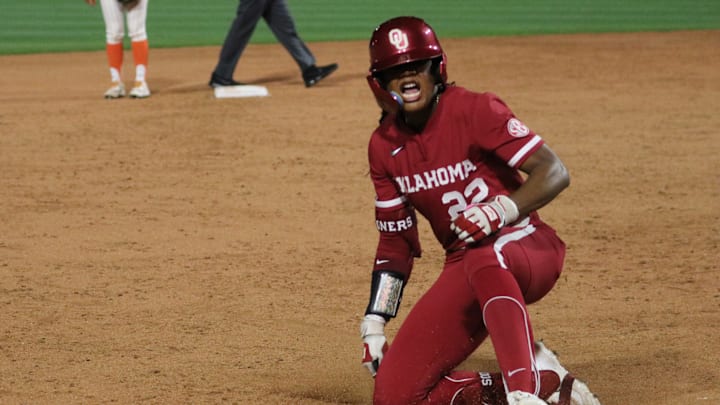 Oklahoma outfielder Kai Minor slides into third after hitting a triple against Oklahoma State in a Bedlam contest at Devon Park.