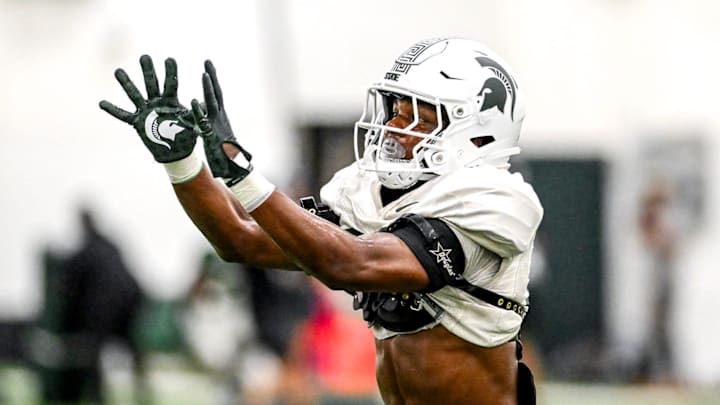 Michigan State's Armorion Smith catches a ball during a drill as part of fall camp on Monday, Aug. 5, 2024, at the indoor practice facility in East Lansing.