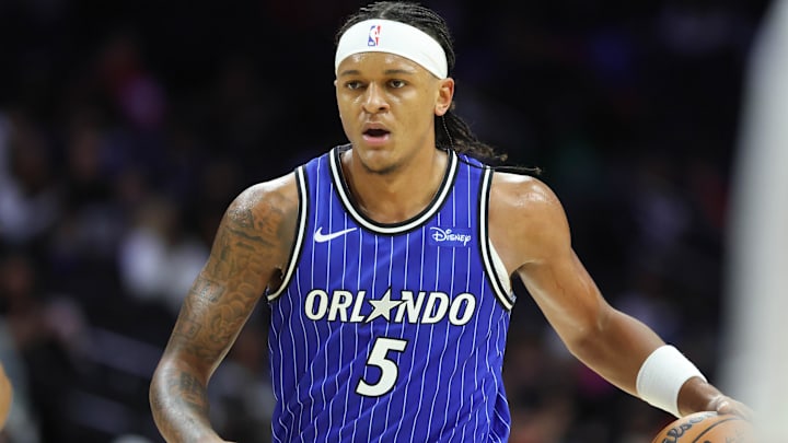 Oct 10, 2025; Philadelphia, Pennsylvania, USA; Orlando Magic forward Paolo Banchero (5) dribbles the ball against the Philadelphia 76ers during the third quarter at Xfinity Mobile Arena. Mandatory Credit: Bill Streicher-Imagn Images
