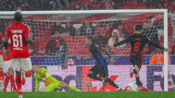 Barcelona came from behind and defeated Benfica 5-4 in a thrilling match.