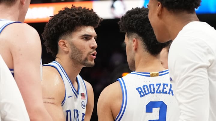 Mar 12, 2026; Charlotte, NC, USA; Duke Blue Devils forward Cameron Boozer (12) with guard Cayden Boozer (2) in the second half at Spectrum Center. Mar 12, 2026; Charlotte, NC, USA; Duke Blue Devils forward Cameron Boozer (12) with guard Cayden Boozer (2) in the second half at Spectrum Center.