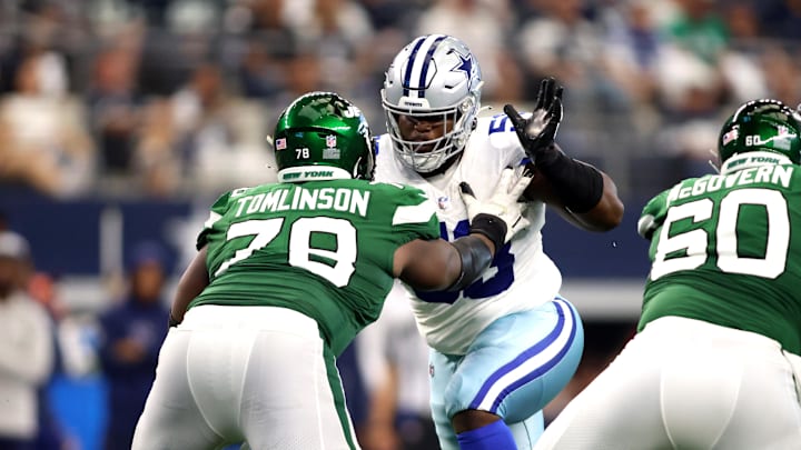 Dallas Cowboys defensive tackle Mazi Smith rushes the passer while blocked by New York Jets guard Laken Tomlinson.