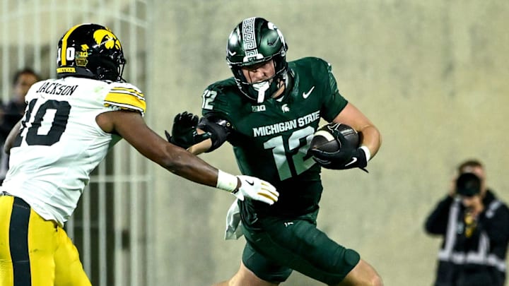 Michigan State's Jack Velling, right, runs after a catch as Iowa's Nick Jackson closes in during the third quarter on Saturday, Oct. 19, 2024, at Spartan Stadium in East Lansing.