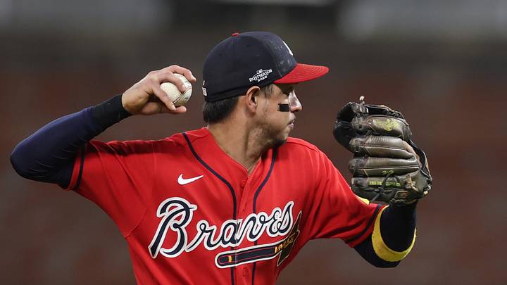 Oct 6, 2026; Cumberland, Georgia, USA;  Atlanta Braves outfielder Mauricio Dubon (14) throws to first base for the out against the Los Angeles Dodgers in game three of the NLDS for the 2026 MLB Playoffs at Truist Park.  Mandatory Credit: Brett Davis-Imagn Images