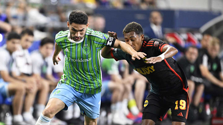 Aug 8, 2024; Seattle, Washington, USA; Seattle Sounders FC midfielder Cristian Roldan (7) controls the ball during the second half against LA Galaxy defender Mauricio Cuevas (19) at Lumen Field. Mandatory Credit: Troy Wayrynen-USA TODAY Sports