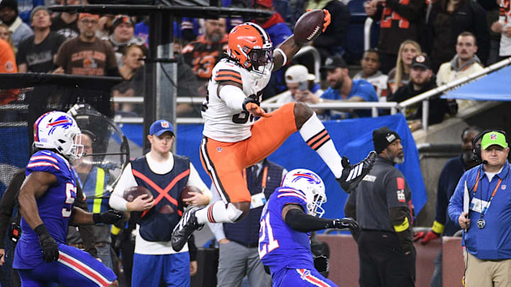 Nov 20, 2022; Detroit, Michigan, USA; Cleveland Browns tight end David Njoku (85) jumps over Buffalo Bills safety Jordan Poyer (21) during the third quarter at Ford Field. Nov 20, 2022; Detroit, Michigan, USA; Cleveland Browns tight end David Njoku (85) jumps over Buffalo Bills safety Jordan Poyer (21) during the third quarter at Ford Field.