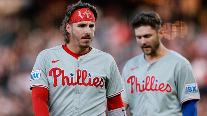 May 20, 2025; Denver, Colorado, USA; Philadelphia Phillies second baseman Bryson Stott (5) and shortstop Trea Turner (7) in the fourth inning against the Colorado Rockies at Coors Field