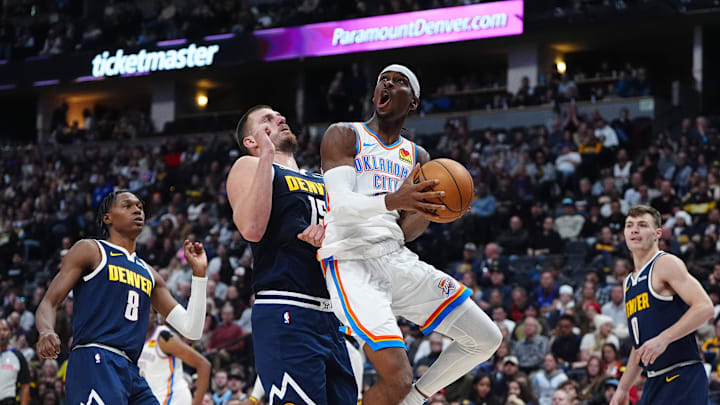 Nov 6, 2024; Denver, Colorado, USA; Oklahoma City Thunder guard Shai Gilgeous-Alexander (2) shoots the ball past Denver Nuggets center Nikola Jokic (15) in the second quarter at Ball Arena. Mandatory Credit: Ron Chenoy-Imagn Images Nov 6, 2024; Denver, Colorado, USA; Oklahoma City Thunder guard Shai Gilgeous-Alexander (2) shoots the ball past Denver Nuggets center Nikola Jokic (15) in the second quarter at Ball Arena. Mandatory Credit: Ron Chenoy-Imagn Images