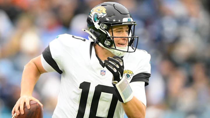 Dec 8, 2024; Nashville, Tennessee, USA;  Jacksonville Jaguars quarterback Mac Jones (10) scrambles against the Tennessee Titans during the second half at Nissan Stadium. Mandatory Credit: Steve Roberts-Imagn Images