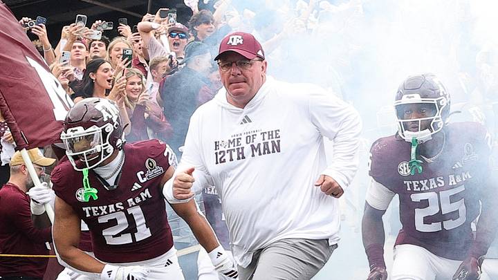 Dec 20, 2025; College Station, TX, USA; Texas A&M Aggies head coach Mike Elko takes the field prior to the game against the Miami Hurricanes during the first round of the CFP National Playoff at Kyle Field. Mandatory Credit: Maria Lysaker-Imagn Images Dec 20, 2025; College Station, TX, USA; Texas A&M Aggies head coach Mike Elko takes the field prior to the game against the Miami Hurricanes during the first round of the CFP National Playoff at Kyle Field. Mandatory Credit: Maria Lysaker-Imagn Images