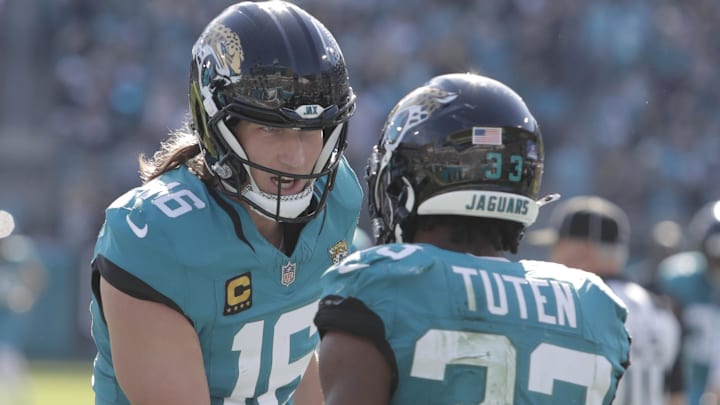Dec 14, 2025; Jacksonville, Florida, USA; Jacksonville Jaguars quarterback Trevor Lawrence (16) and running back Bhayshul Tuten (33) react after scoring a touchdown during the second quarter against the New York Jets at EverBank Stadium. Mandatory Credit: Travis Register-Imagn Images Dec 14, 2025; Jacksonville, Florida, USA; Jacksonville Jaguars quarterback Trevor Lawrence (16) and running back Bhayshul Tuten (33) react after scoring a touchdown during the second quarter against the New York Jets at EverBank Stadium. Mandatory Credit: Travis Register-Imagn Images