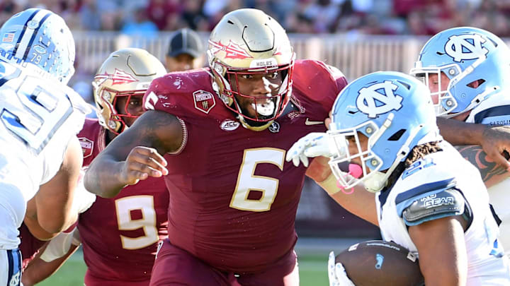 Nov 2, 2024; Tallahassee, Florida, USA; Florida State Seminoles defensive tackle Darrell Jackson Jr (6) pursues North Carolina Tarheels running back Davion Gause (21) in the second quarter at Doak S. Campbell Stadium. Mandatory Credit: Robert Myers-Imagn Images Nov 2, 2024; Tallahassee, Florida, USA; Florida State Seminoles defensive tackle Darrell Jackson Jr (6) pursues North Carolina Tarheels running back Davion Gause (21) in the second quarter at Doak S. Campbell Stadium. Mandatory Credit: Robert Myers-Imagn Images