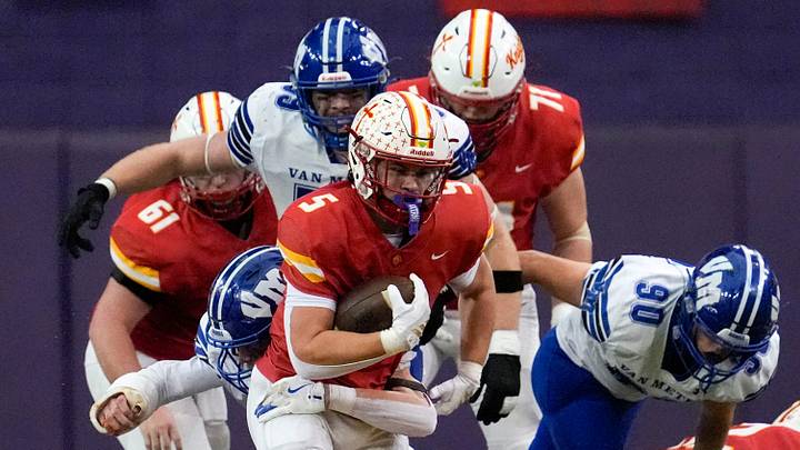 Kuemper Catholic’s Jarin Hoffman (5) carries the ball against the Van Meter Bulldogs Nov. 21, 2025 during the Class 2A high school state football championship at the UNI-Dome in Cedar Falls, Iowa. Kuemper Catholic’s Jarin Hoffman (5) carries the ball against the Van Meter Bulldogs Nov. 21, 2025 during the Class 2A high school state football championship at the UNI-Dome in Cedar Falls, Iowa.