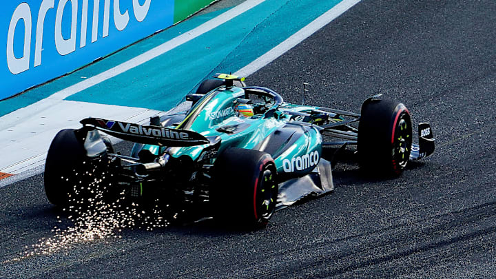 zMay 4, 2024; Miami Gardens, Florida, USA; Aston Matrin driver Fernando Alonso (14) scrapes the track as sparks fly racing into turn five during qualifying for the Miami Grand Prix at Miami International Autodrome. Mandatory Credit: John David Mercer-Imagn Images