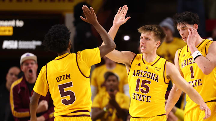 Jan 24, 2026; Tempe, Arizona, USA; Arizona State Sun Devils guard Maurice Odum (5) celebrates with teammate Noah Meeusen (15) against the Cincinnati Bearcats in the first half at Desert Financial Arena. Mandatory Credit: Mark J. Rebilas-Imagn Images