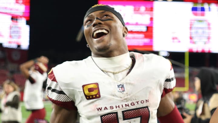 Jan 12, 2025; Tampa, Florida, USA; Washington Commanders wide receiver Terry McLaurin (17) and linebacker Bobby Wagner (54) celebrate after winning a NFC wild card playoff against the Tampa Bay Buccaneers at Raymond James Stadium. Mandatory Credit: Nathan Ray Seebeck-Imagn Images