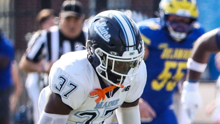 Delaware wide receiver Phil Lutz runs for the end zone on a first quarter touchdown reception in front of Maine's Devin Vaught (left) and Kesean Dyson at Delaware Stadium, Saturday, Oct. 12, 2024. Delaware wide receiver Phil Lutz runs for the end zone on a first quarter touchdown reception in front of Maine's Devin Vaught (left) and Kesean Dyson at Delaware Stadium, Saturday, Oct. 12, 2024.