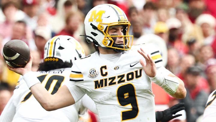 Nov 22, 2025; Norman, Oklahoma, USA;  Missouri Tigers quarterback Beau Pribula (9) throws during the game against the Oklahoma Sooners at Gaylord Family-Oklahoma Memorial Stadium. Mandatory Credit: Kevin Jairaj-Imagn Images
